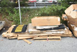 Boxes of new scratch and dent items, including a Lancaster Table & Seating 30" round table and folding table dolly.