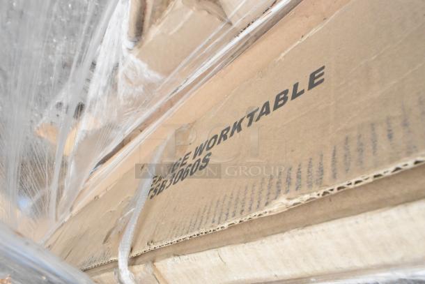 Cardboard box labeled "WORKTABLE TSBT3060S," wrapped in plastic, part of auction item including Regency drawer and table.