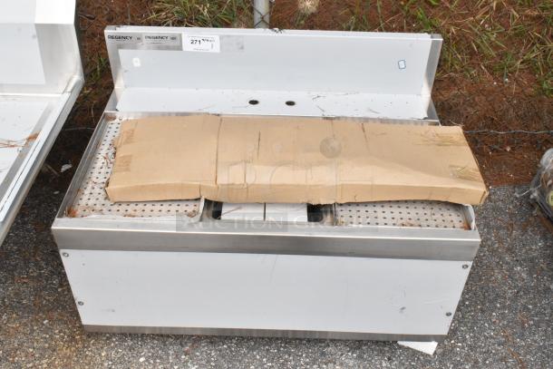 Brand new Regency 600B1243612S underbar sink, 36"x24", with faucet and drainboards, some scratches and dents.