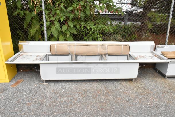 Brand new Regency 600S3242424S stainless steel sink, three compartments, 124", 14 gauge, with two 24" drainboards. Scratch and dent condition.