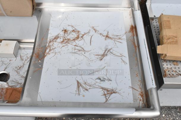 Brand new Regency 600S3242424S commercial sink, 14 gauge stainless steel, three compartments, 2 drainboards, some scratches visible.