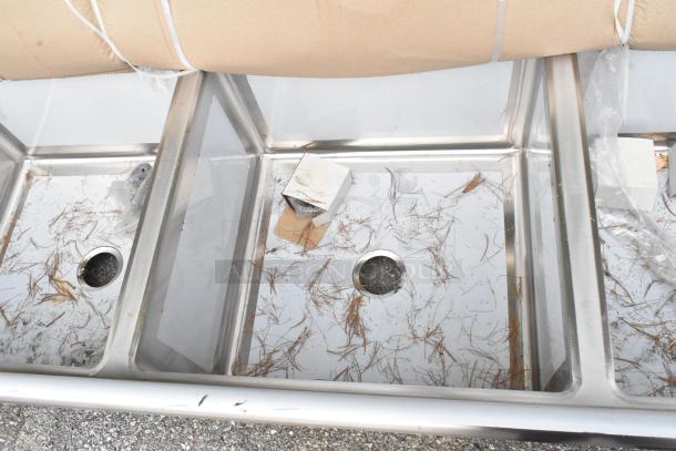 Brand new Regency 600S3242424S 124" 14-gauge stainless steel 3-compartment sink with 2 drainboards. Scratch and dent condition.