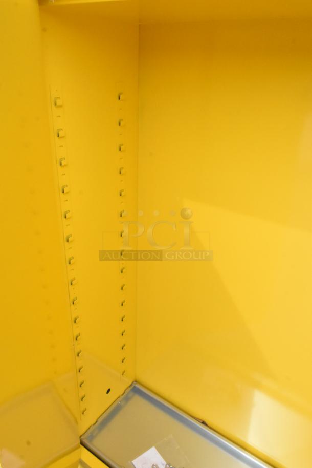 Brand new scratch and dent yellow metal two-door cabinet interior, adjustable shelving, bright finish.