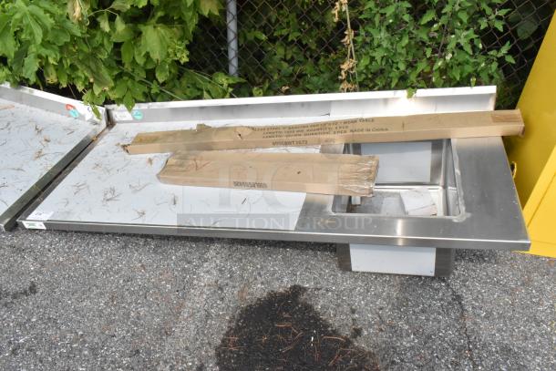 BRAND NEW SCRATCH AND DENT Regency 600ST3072R stainless steel table with single bay sink. Boxed, some visible scratches.