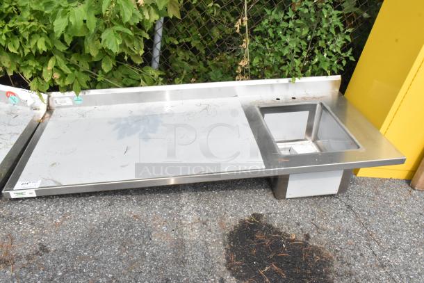 Brand new Regency 600ST3072R stainless steel table with single bay sink. Scratch and dent condition. Tags visible.