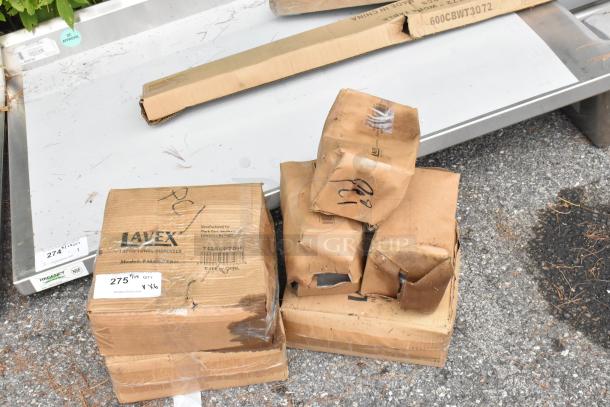 Boxes of Lavex scratch and dent stainless steel items, some damaged. Includes C-fold towel and liquid soap dispensers.