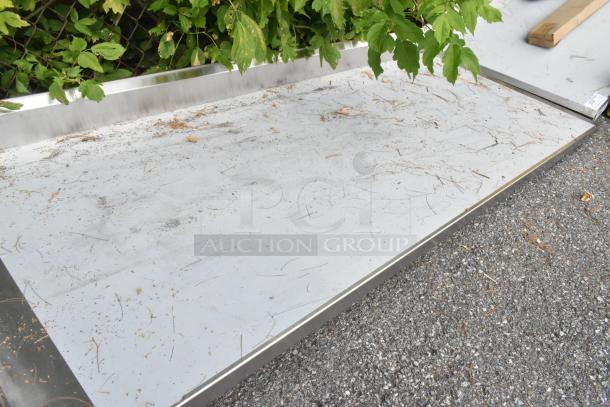 Regency 600ST3096L stainless steel table with single bay sink, scratch and dent, new condition, outdoors.