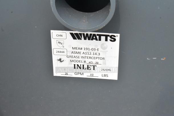 BRAND NEW Watts WD-20 Grease Interceptor, 40 lb. capacity, model info label visible, minor scratches present.