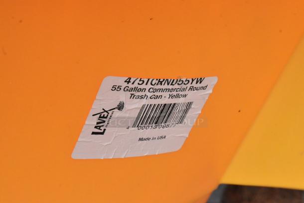 BRAND NEW Lavex 55 Gallon Yellow Round Trash Can, model 475TCRND55YW. Minor dents, labeled "Made in USA."