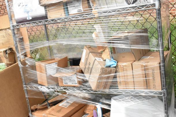 Chrome 4-tier wire shelving unit on casters with assorted poly bins and boxes, shrink-wrapped, requires dismantling.