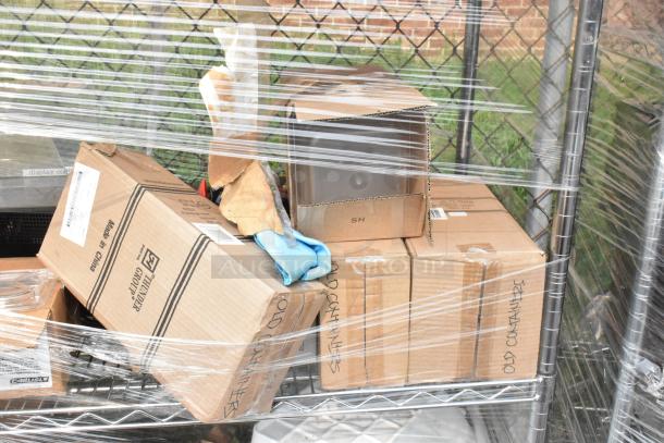 Chrome finish 4-tier wire shelving unit on casters, includes new poly bins and boxed contents. Buyer must dismantle.