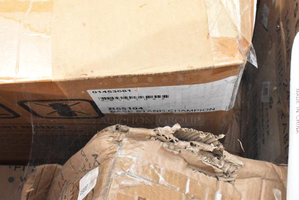 Box containing 15 brand new scratch and dent items. Visible label reads "R55104 Base Stand, Champion," with barcode 01453661.