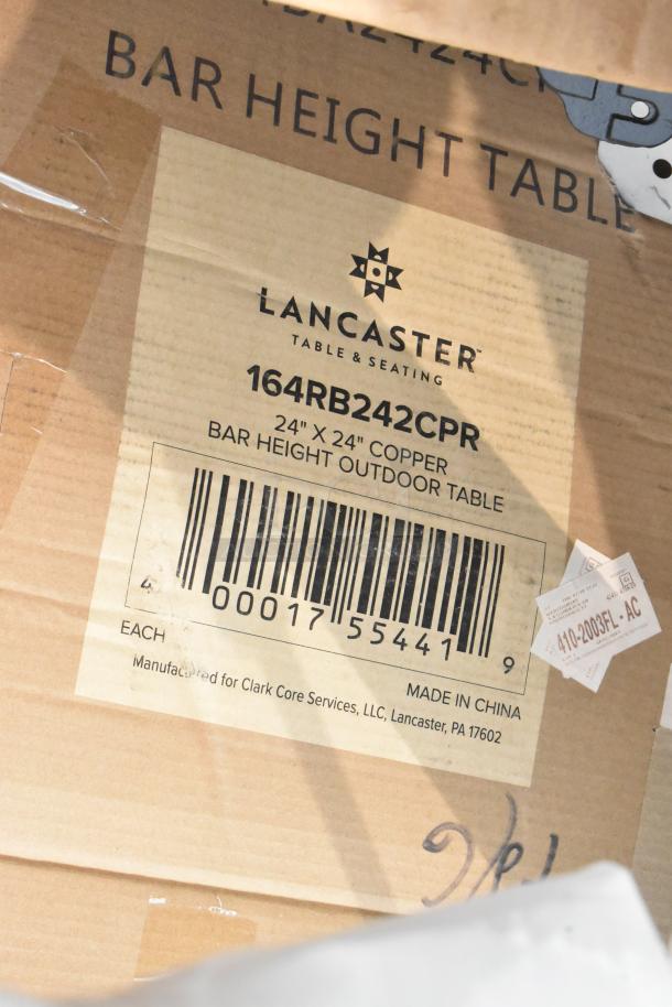 Cardboard packaging of a Lancaster Table & Seating 24"x24" copper bar height outdoor table with barcode and item label.