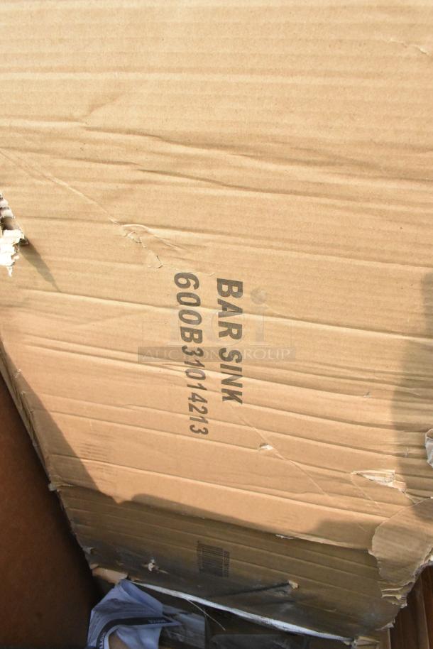 Cardboard box marked "BAR SINK 600B31014213" indicating Regency 3 Bowl Underbar Sink. Box has visible damage.