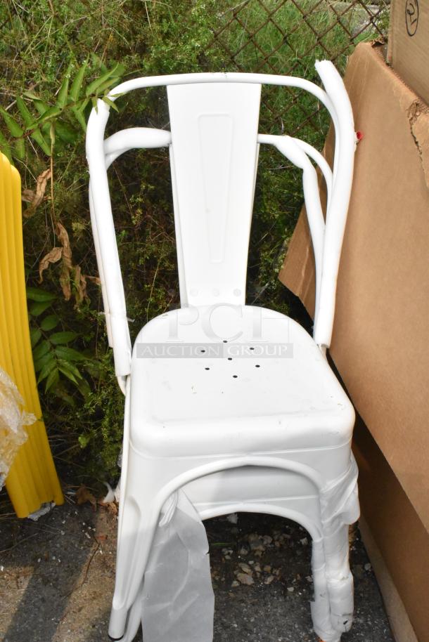 White Tolix-style metal chair, scratch and dent condition, wrapped in protective material.