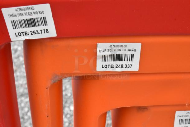 Lancaster Table & Seating Rio resin side chairs in red and orange. Tags read "427RIOSIDERD" and "427RIOSIDEOG" with lot numbers.
