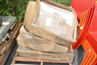 Four boxes, scratched and dented, contain a Regency 600ES3036GK stainless steel equipment stand and an American Louver plaque diffuser on a pallet.
