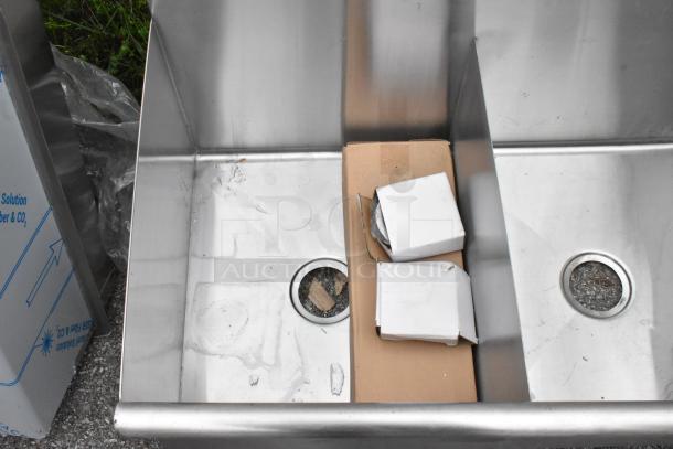BRAND NEW Steelton 522US21821 utility sink, 18"x21"x14", two-compartment, for 8" center faucet. Slight scratches visible.