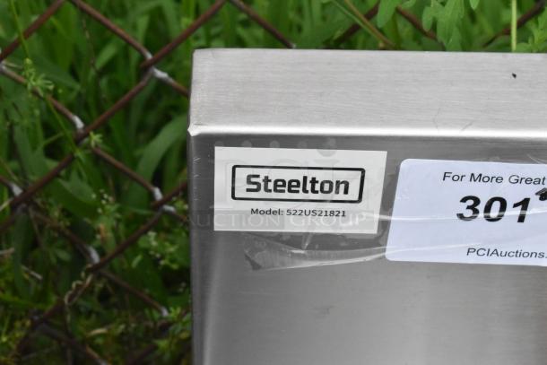 "Steelton 522US21821 utility sink corner. Model tag details visible. Brand new, scratch and dent condition."