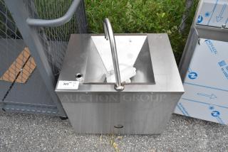 Stainless steel single bay sink with high-arc faucet, pre-owned condition, auction tag visible on top left.