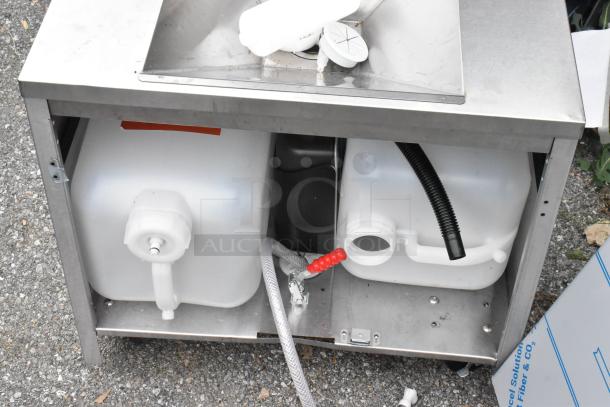 Stainless steel single bay sink with integrated water tanks and hose. Durable, commercial-grade construction.