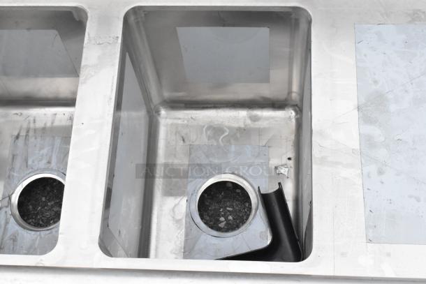 Regency 600S21014216 stainless steel 2 bay sink, scratch and dent condition, with dual drain boards, no legs included.