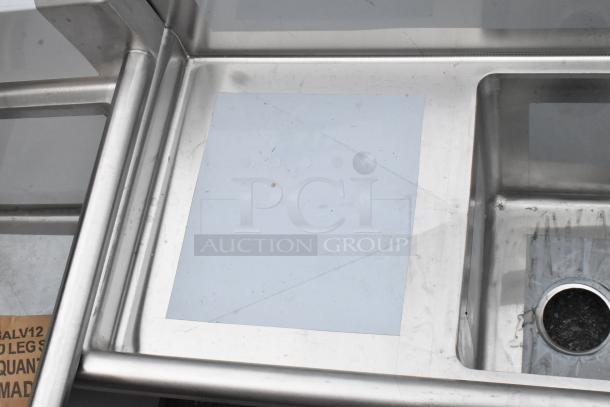 BRAND NEW Regency 600S21014216 2 bay stainless steel sink with dual drain boards. Scratch and dent condition, no legs.