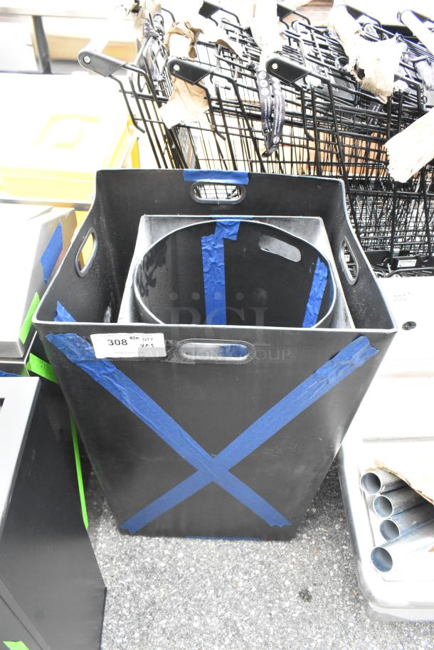 Three brand new scratch and dent trash cans with blue tape; labeled "308" for auction.