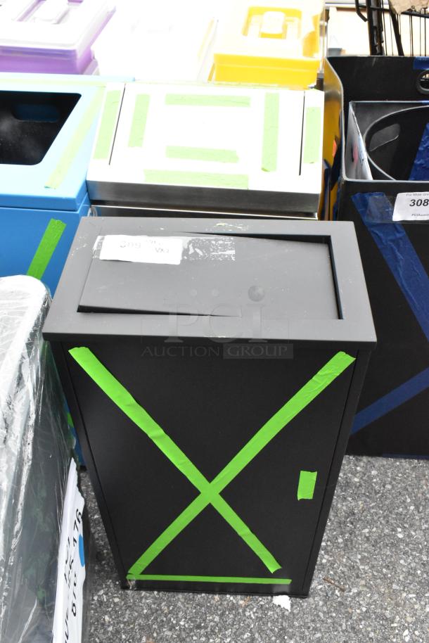 Black and chrome finish trash can, brand new, scratch and dent condition, green tape markings, auction item.