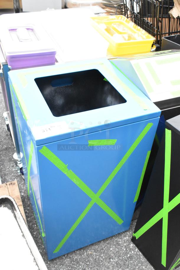 Blue metal trash can shell, brand new with scratches and dents. Marked with green tape, tag reads "3111."