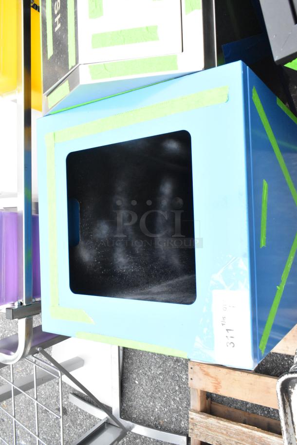 Brand new blue metal trash can shell with visible scratches and dents, labeled "3115 01" on side, taped edges.