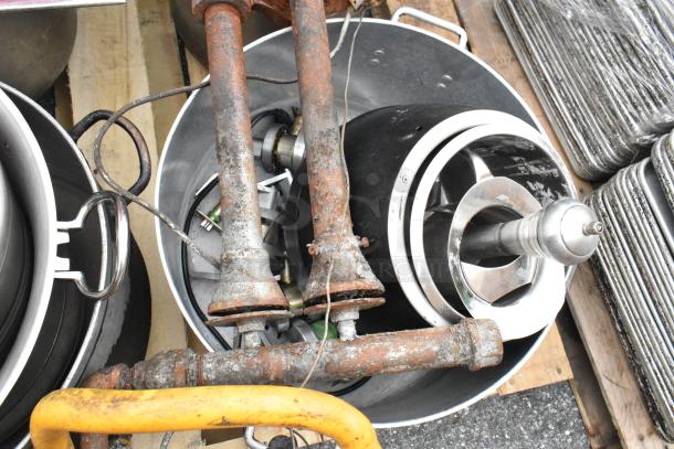 Pallet lot with red salad spinner, metal pots, rusty burners, and gas hoses in fair to poor condition.