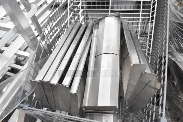 Gray shopping cart filled with metal pieces, various sizes and shapes, in good condition.