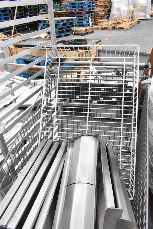 Gray shopping cart filled with metal pieces, showing industrial context and used condition. No visible labels.