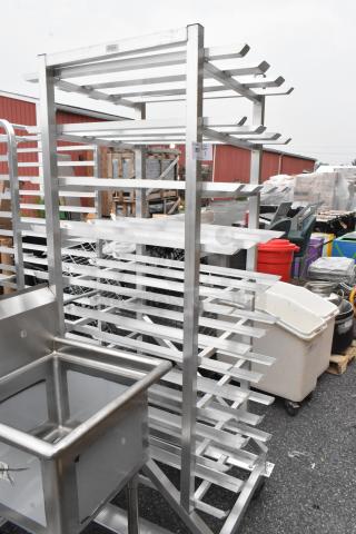 Metal Commercial #10 Can Rack with multiple shelves, mounted on durable commercial casters, in good condition.
