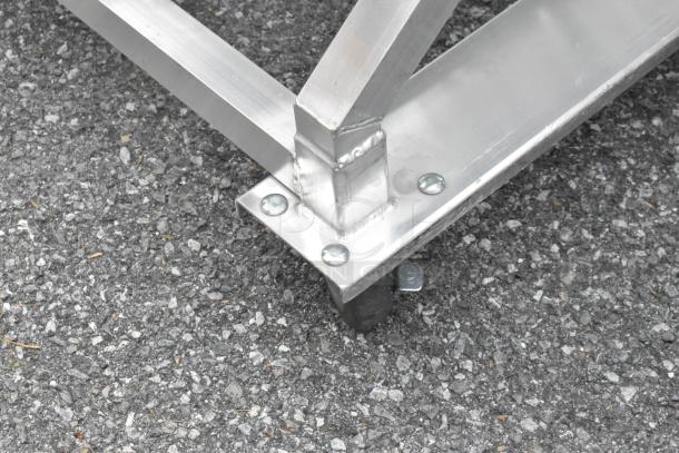 Metal commercial #10 can rack on durable casters, showcasing sturdy construction and smooth mobility.