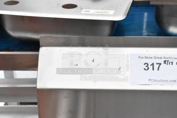 Stainless steel single bay sink with two pre-drilled holes, NSF sticker visible. Auction tag reads "317".