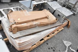 6 new scratch and dent items including Regency grease traps and stainless steel legs. Boxes slightly damaged.