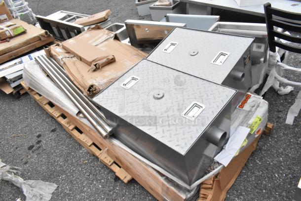 Brand new Regency grease traps and stainless steel legs on pallets, some boxes slightly damaged, items in mint condition.