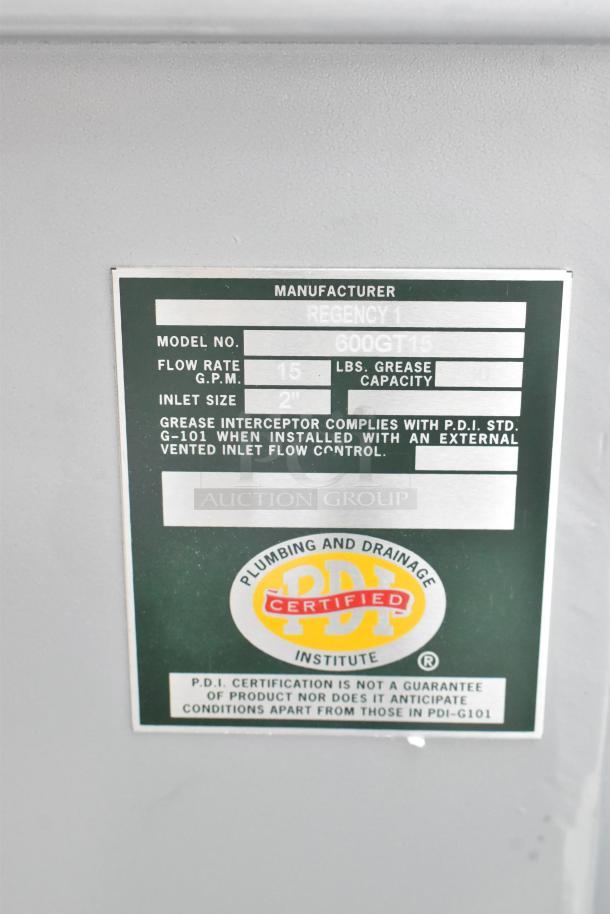 Label on Regency 600GT15 grease trap; 15 GPM, 30 lb. capacity, 2" inlet, PDI certified.