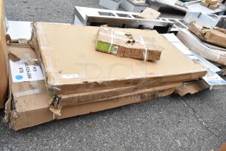 Five boxed scratch-and-dent items, including a tabletop Thermo Form 3048 GRY wood and Steelton stainless steel work table.