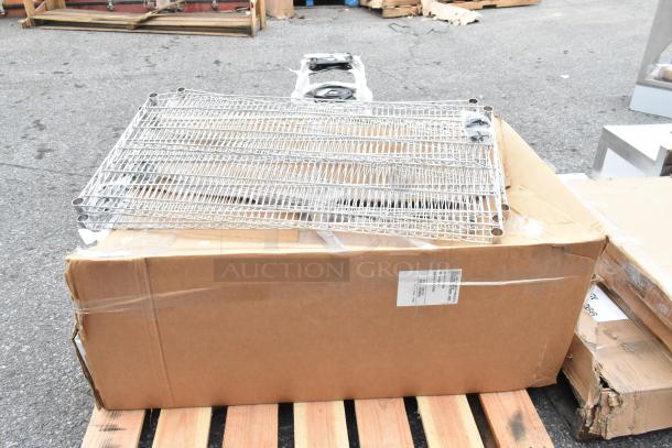 5 brand new items including Cal-Mil bakery display case and Regency chrome wire shelf on a pallet. Some boxes are dented.