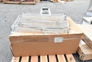 5 brand new items including Cal-Mil bakery display case and Regency chrome wire shelf on a pallet. Some boxes are dented.