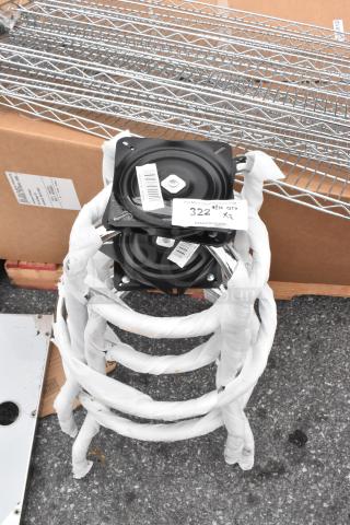 Two brand new 164GS605BFR black metal stool frames with tags, each in a slightly scratched condition, stacked outdoors.
