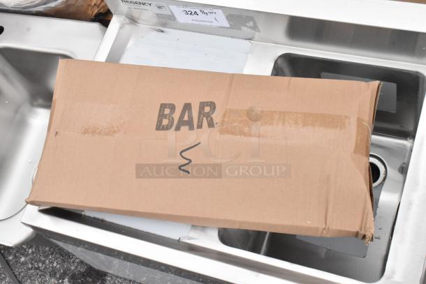 Regency stainless steel 3 bay bar sink with dual drain board, brand new with scratches, model 600B31014213. Box marked "BAR."