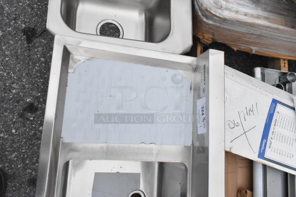 BRAND NEW Regency 600B31014213 stainless steel 3 bay back bar sink with dual drain board, minor scratches visible.