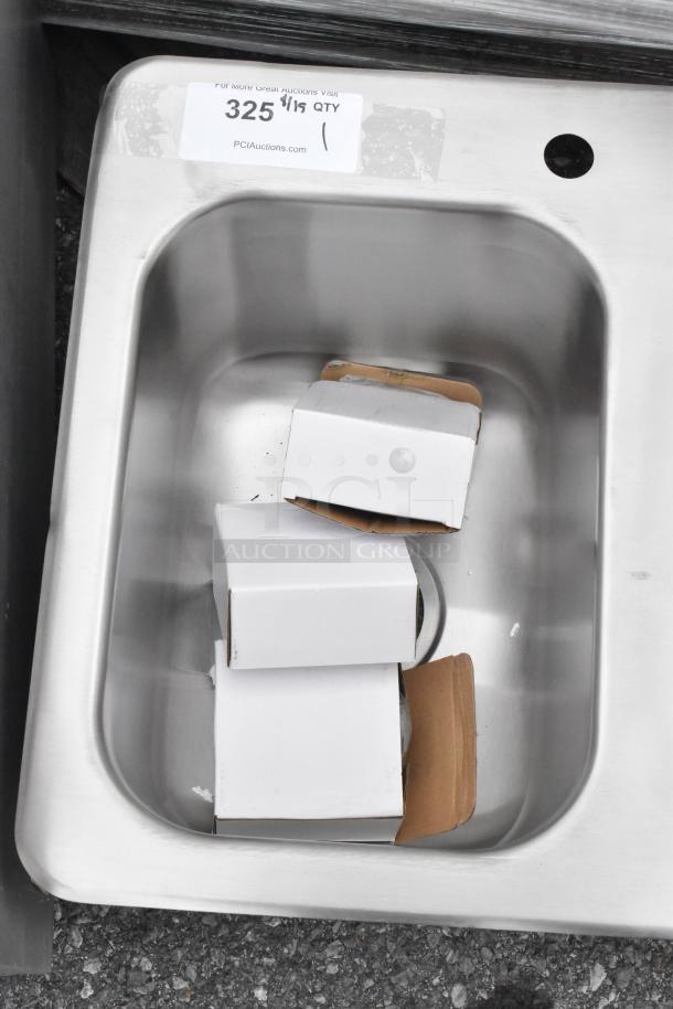 Brand new stainless steel 3 bay drop-in sink with minor scratches and dents. Auction label visible.