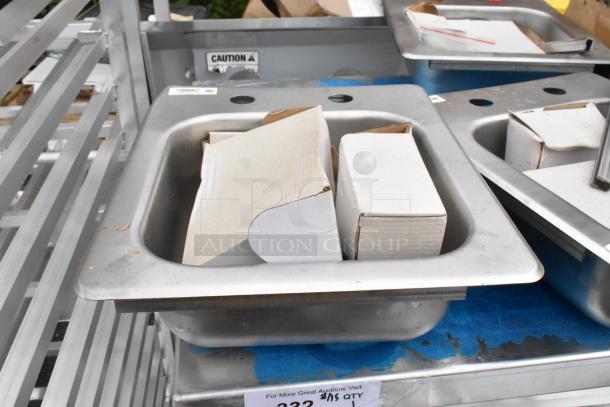 Brand new Regency 600DI1995 9"x9"x5" stainless steel drop-in sink, 18-gauge, one compartment, slightly dented.