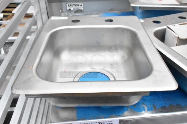 Brand new Regency 600DI1995 9" x 9" x 5" 18-gauge stainless steel one compartment drop-in sink. Scratch and dent condition.