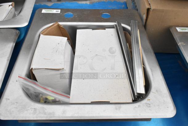 Brand new Regency 600DI1995 stainless steel 9"x9"x5" drop-in sink, 18-gauge, with box and accessories. Contains scratch and dent.
